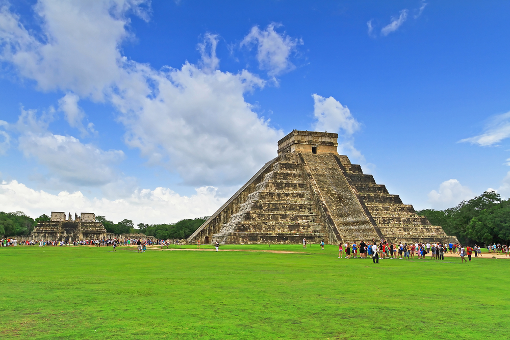 The historic pyramids of Chichen Itza with people 