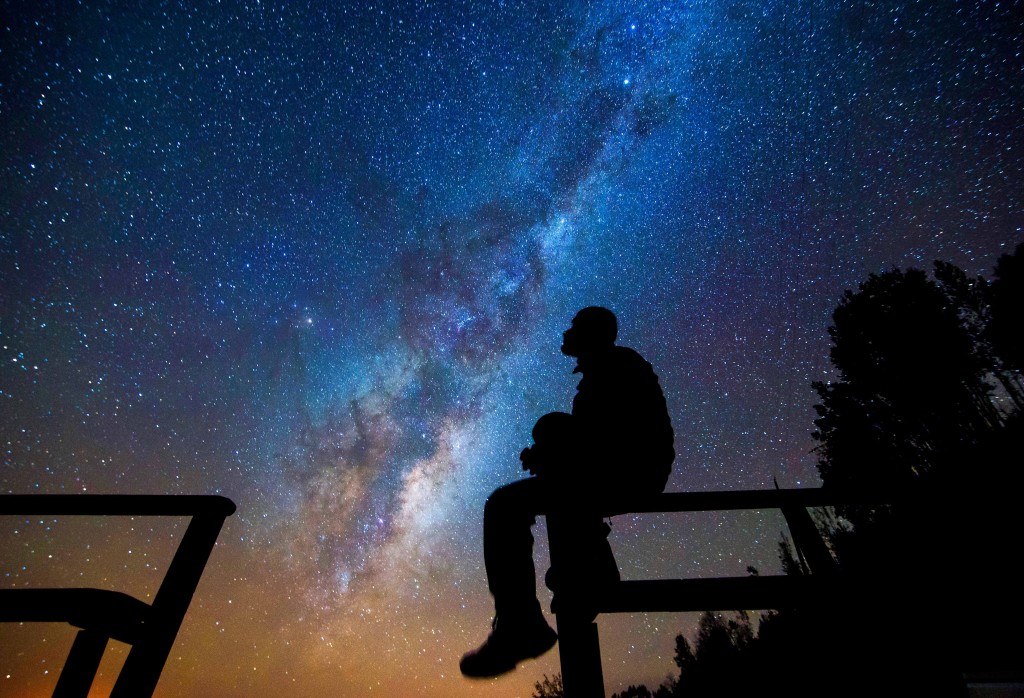 Man looking up at stars in Atacama Desert