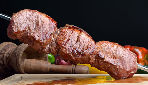 A skewer of beef served at a Brazilian Churrasco