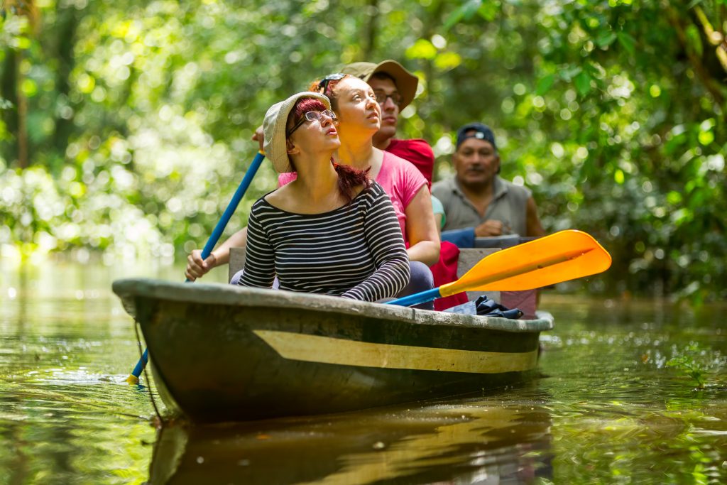 People kayaking on the Amazon River in Peru 