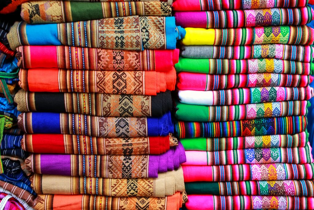 lima market with colourful alpaca wool products displayed credit shuterstock