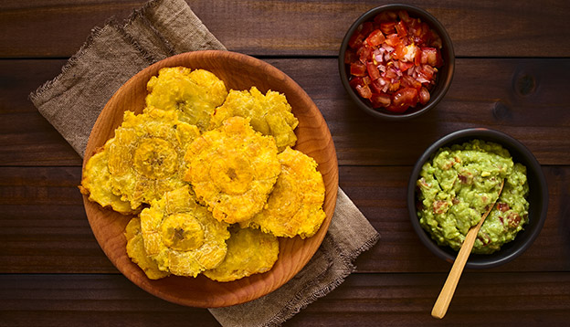 Patacones - fried and flattened pieces of green plantain, traditional snack or accompaniment