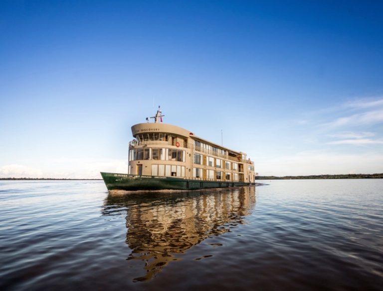 Explore the Amazon: photo of a small ship cruising the Amazon river