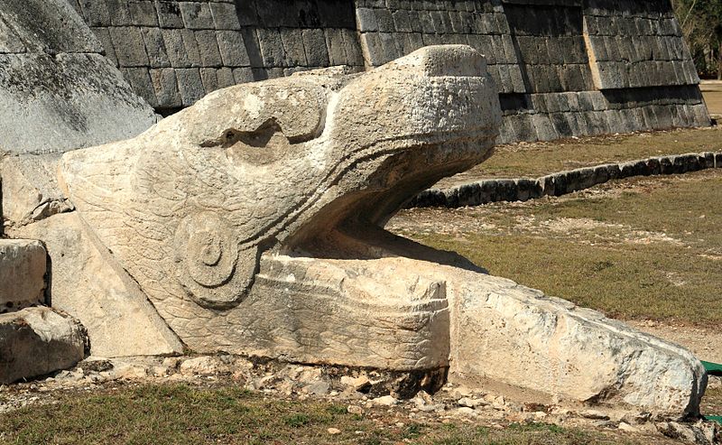 serpent head on ancient mayan ruin in mexico