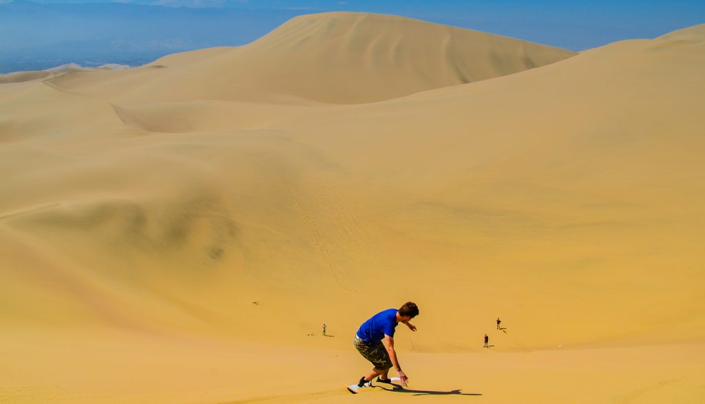 Sand-boarding fun on Atacama Desert, Oasis of Huacachina