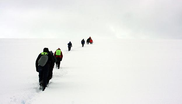 Antarctica Activities: People trekking up a mountain