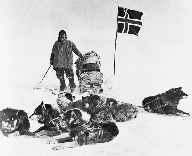 Black and white image of Man with dogs and flag