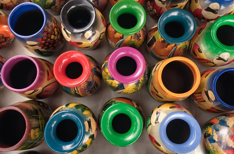 Otavalo, Ecuador- February 17, 2018: colourful indigenous potteries for sale in the weekly artisan market credit shutterstock