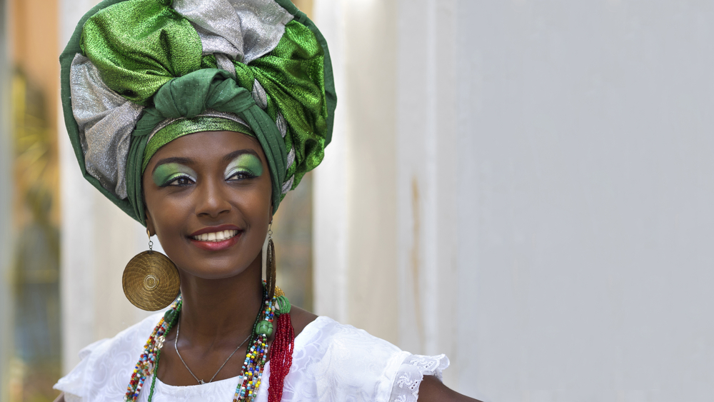 Brazilian woman of African descent, smiling.
