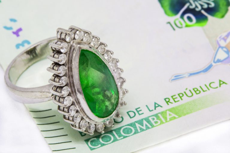 Colombian Emerald Ring and 2016 issued bills credit shutterstock