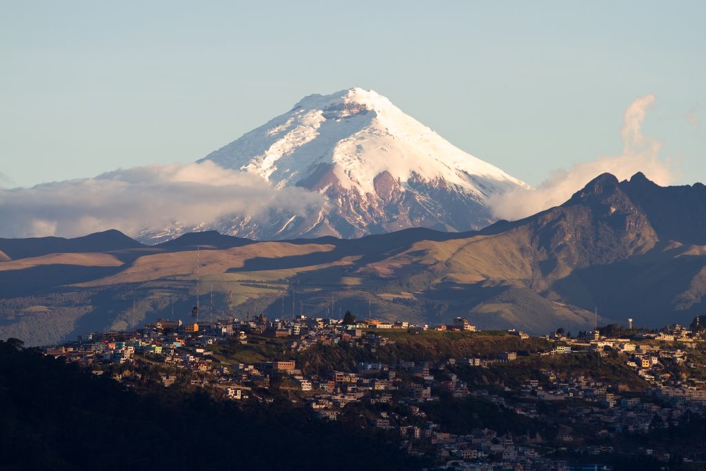 Cotopaxi volcano on the background, and the city on the front 